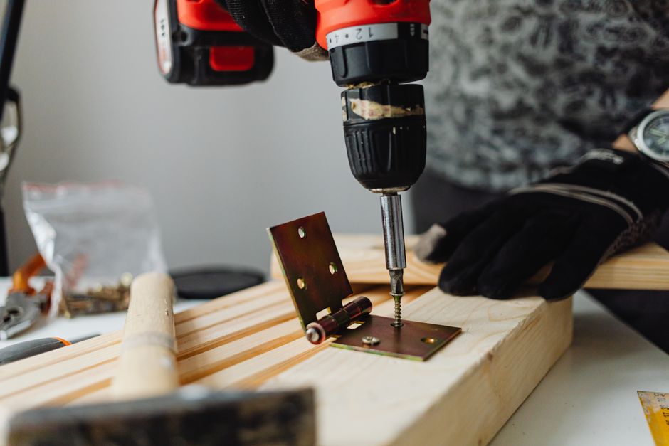 Professional carpenter carefully measuring and installing a door frame