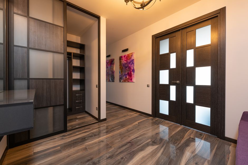 Elegant sliding closet doors installed in a modern bedroom